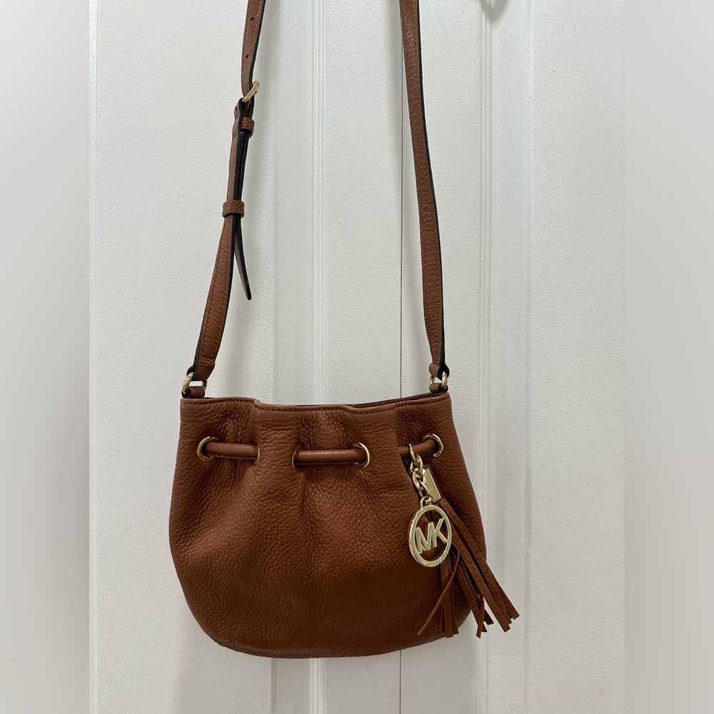 Michael Kors brown bucket bag with gold accent